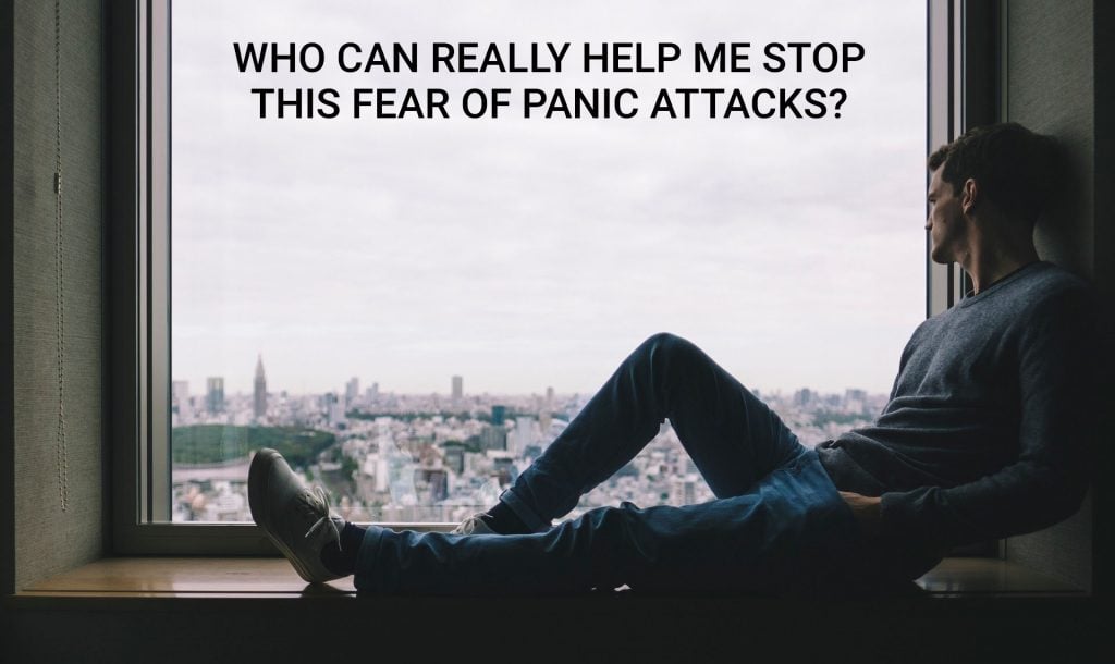 fearing his panic attacks, a man is staring outside his window