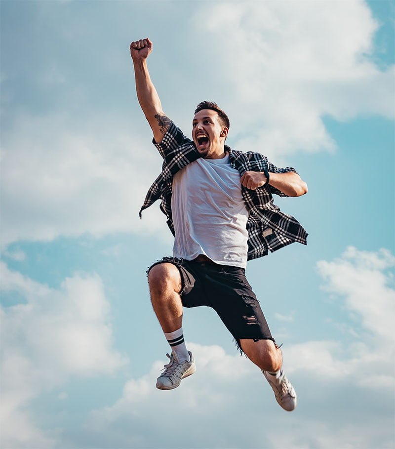 man jumping in excitement fully energized