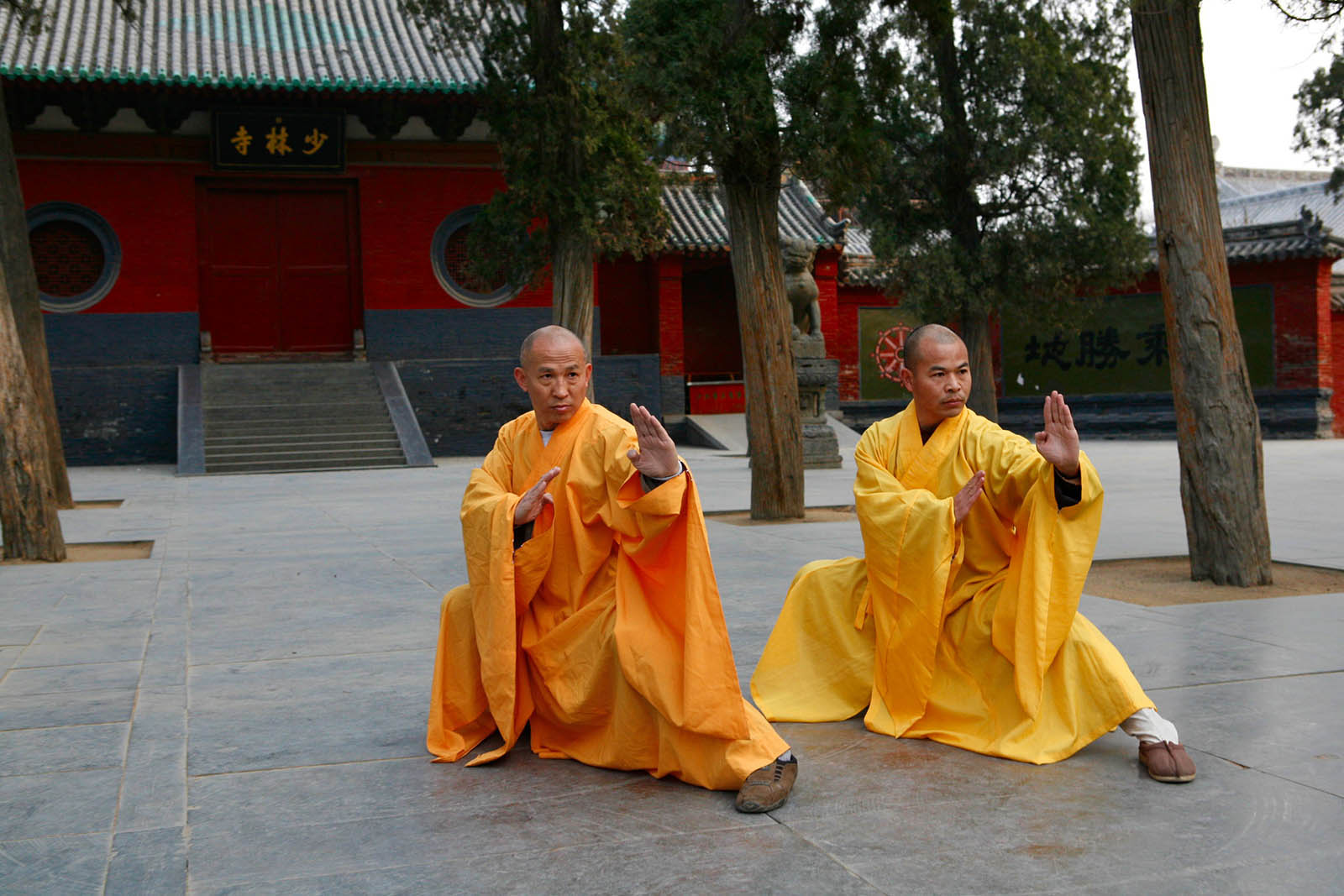sitting meditation preparation by way of martial arts training performed by 2 monks
